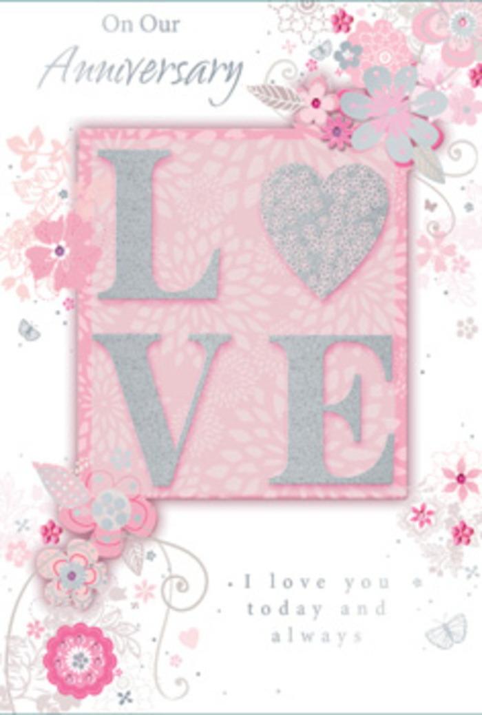 The anniversary card depicted here feels like a quiet, elegant celebration of love, with its colour palette of blush pink, pearlescent white, and soft, shimmering silver recalling the calm beauty of Cobham's tree-lined avenues. Dominating the centre of the design, the word LOVE is set in raised, glitter-brushed letters, each one delicately edged so that it catches the light without appearing garish. The embossing gives the lettering a gentle relief you could imagine feeling under your fingertips, inviting a lingering touch much like the satin ribbon on a luxury bouquet. This central word is nestled into a background wash of warm pink, softly graded and serene, creating the impression of a gentle glow. From around the edges of the letters, a cascade of stylised floral illustrations unfurls: graceful petals, slim leaves, and swirling stems, all drawn with fine, confident lines. The blooms are shaded in blush and creamy white, with accents of silver that glint like sunlight on the River Mole, adding a sense of refinement. These floral elements curl and arc gracefully, evoking the way a Cobham florist might let delicate stems naturally drape when designing an anniversary arrangement for delivery near the High Street or Painshill Park. Tiny decorative touches-dots, curls, and delicate sprays-spice the design with movement and lightness, giving it a dreamy quality without losing clarity. Threaded between the florals, an inscription about anniversaries and ongoing love appears in an elegant script, its flowing strokes echoing the arcs of the leaves and vines. The overall feeling is that of a cherished keepsake card, as tender and thoughtfully composed as a hand-delivered bouquet marking years of shared memories.