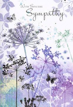 The artwork on this sympathy card feels like a tender watercolour sketch of nature seen through reflective eyes. Across the background, soft gradients of lavender, dusky violet, and misty blue blend seamlessly, anchored by touches of muted green at the base, evoking the gentle tones of fields around Cobham on an overcast morning. Rising from this tranquil wash are tall, spidery stems of umbelliferous blooms, each one fine and lightly drawn, with their flower heads forming intricate, umbrella-shaped silhouettes. The florets at the edges are so delicately rendered that they appear almost transparent, as though the petals are dissolving into the air, capturing the sense of life continuing even in quiet moments of loss. A few butterflies are scattered among the floral stems, their wings outlined softly and filled with translucent notes of blue and violet. They do not command attention; instead, they seem to float alongside the flowers, echoing the idea of gentle companionship and transformation, like a comforting presence walking beside you along Downside or Stoke Road when the village feels particularly still. The illumination is subtle and even, with diffuse light that makes the scene feel calm and contemplative rather than dramatic. Nothing in the composition shouts; it all whispers. The cool colour palette gives the card an understated elegance, offering solace through calm beauty rather than bright cheerfulness. Along the upper part of the illustration, a reserved, heartfelt line of condolence is inscribed in flowing script, leaving plenty of breathing room around it. As a Cobham florist who regularly prepares sympathy flowers for local services, I recognise how this card's gentle design can accompany a bouquet or arrangement to convey sincere sympathy with grace and quiet depth.