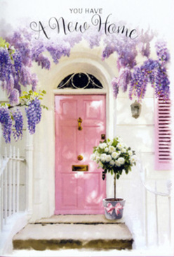 The image presents a quietly enchanting Cobham entryway, the sort you might discover on a peaceful stroll near the River Mole or tucked behind the boutiques on the High Street. At the heart of the composition is a beautifully painted pink front door, its blush tone radiating warmth and charm, suggesting a home that is both stylish and deeply loved. The door is framed by whitewashed walls and a single soft-toned shutter, their slightly textured surfaces catching bands of gentle light and shade. Across the top of the doorway, wisteria cascades in abundant streams, each lavender cluster of blossom hanging in soft, fragrant curtains that frame the entrance with natural grace. Beneath this canopy, on the doorstep, rests a chic grey bucket filled to overflowing with white and cream roses. The roses are lush and full, petals layered and velvety, interspersed with tender sprigs of green foliage that add freshness and depth. Tied around the bucket is a satin pink ribbon, its delicate bow mirroring the door's hue and drawing the eye to the harmony of the colour palette. The entire scene feels like a tender celebration of new beginnings, as though the flowers have just been hand-delivered for a housewarming in Cobham's leafy lanes or one of its elegant new developments. It speaks of thoughtful gestures-a friend or relative choosing a classic, romantic arrangement to wish someone happiness in their new address. The interplay of soft light, gentle pastels, and abundant blooms captures the emotion of stepping over a threshold for the first time: hopeful, grateful, and quietly joyful.