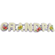 The photograph presents a personalised funeral tribute, with the word GRANDPA spelled out in a straight horizontal line of flowers, reminiscent of designs often seen at Cobham memorial services. Each of the seven block letters is constructed from small white chrysanthemums, packed so closely together that they form dense, cushion-like shapes. The blooms are uniform and pristine, creating a pure white surface that suggests serenity and gentle remembrance, much like a soft pillow laid out in honour. A narrow edging of pale lavender ribbon runs neatly along the lower edge of each letter, providing a subtle lavender outline that helps define the forms while adding a touch of understated colour. Beneath and behind the letters, slim dark green bars hold everything securely in place, largely hidden from view so the focus remains on the floral artistry. Splashes of vivid colour introduce emotion and character: on the G and the D, clusters of deep red anthuriums burst forward, their glossy, heart-shaped petals and upright yellow spadices framed by rich green foliage. These bold accents feel like declarations of love amid the calm. The first A and the final A carry sprays of yellow-green orchids, their refined, arching petals and buds nestled among leaves, adding a more delicate, hopeful note. The overall effect is one of dignity and tenderness, the sort of tribute you might find in a Cobham church, at a crematorium near the village, or resting by a grave in a local cemetery, offering a beautifully crafted, floral farewell to a cherished grandad created by a florist who understands the tone and traditions of the area.